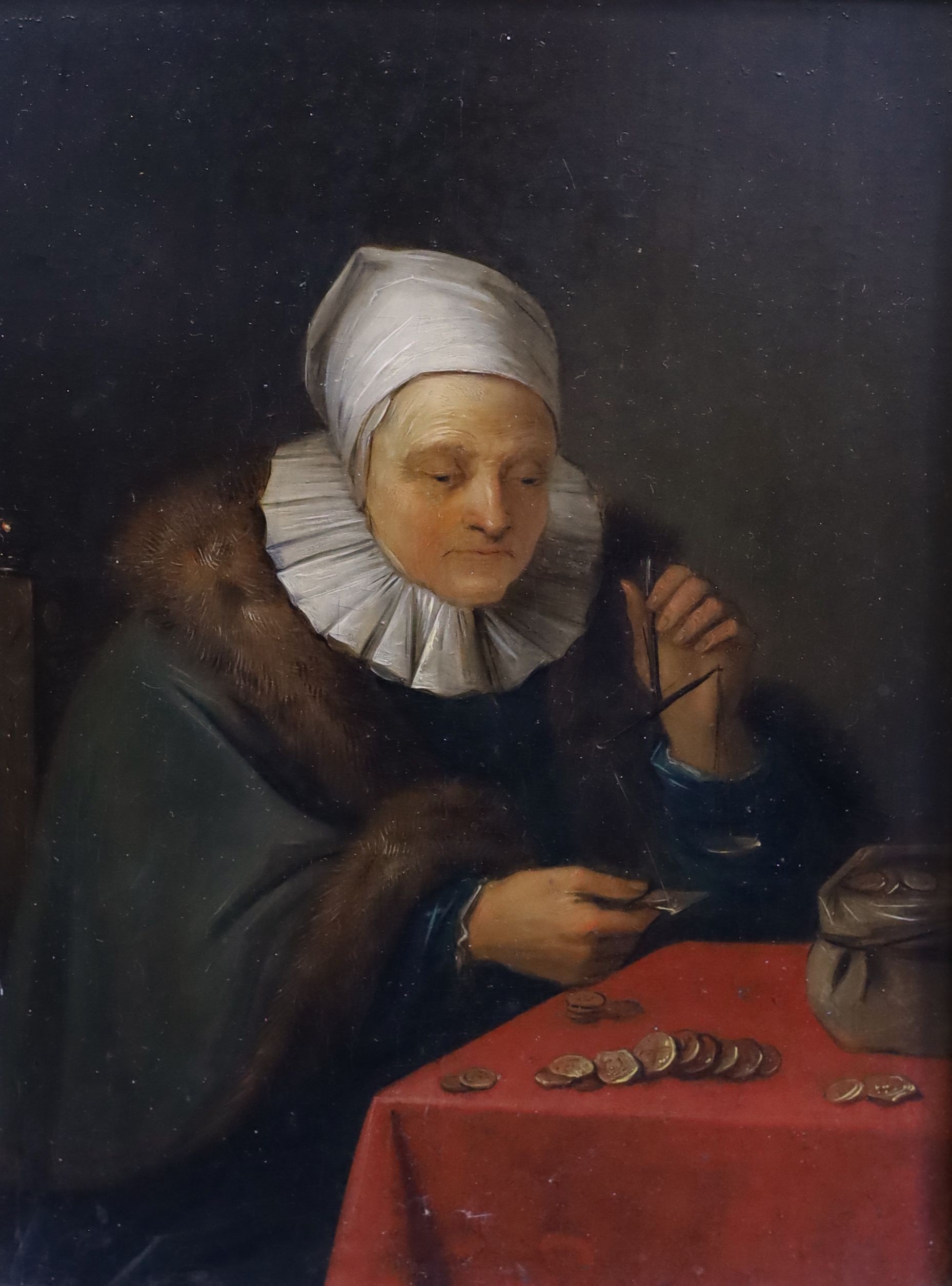 18th century Flemish School, Woman seated at a table counting money, oil on wooden panel, 18.5 x 14cm